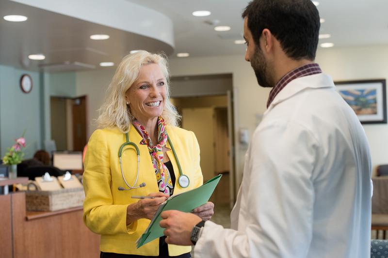 Pamela Munster, MD, co-leader at the Center for BRCA Research, speaks with Protocol Project Manager Kamran Abril Lavasani at the Helen Diller Family Comprehensive Cancer Center at Mount Zion.